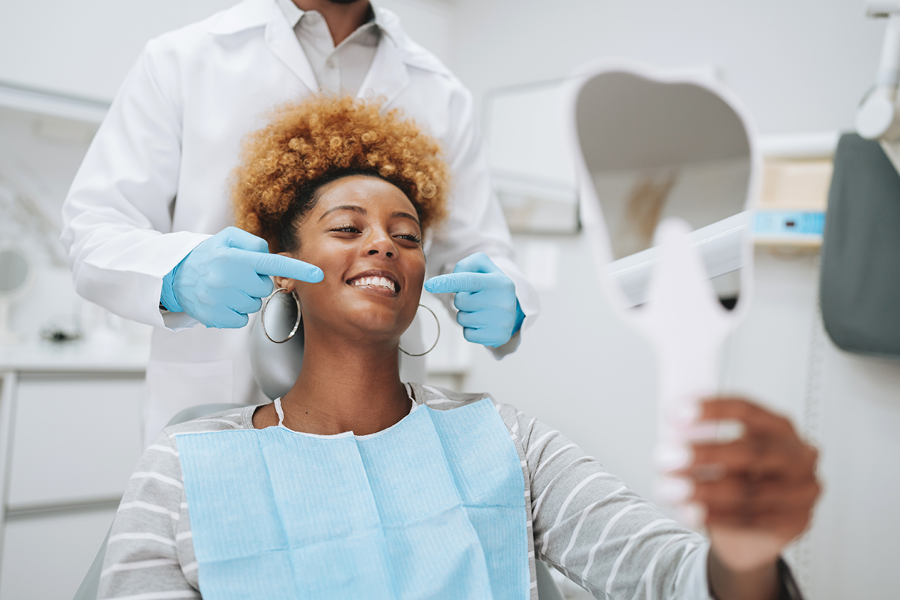 Person getting their teeth examined at the dentist.