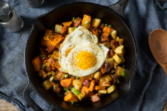 image of sweet potatoes and egg in skillet