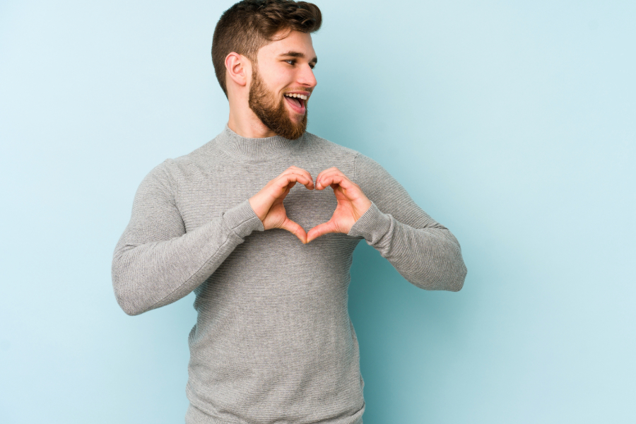 man show heart sign with hands