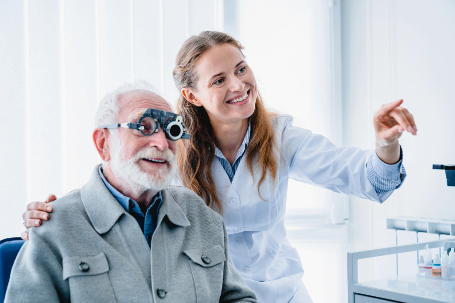 image of senior man getting an eye exam